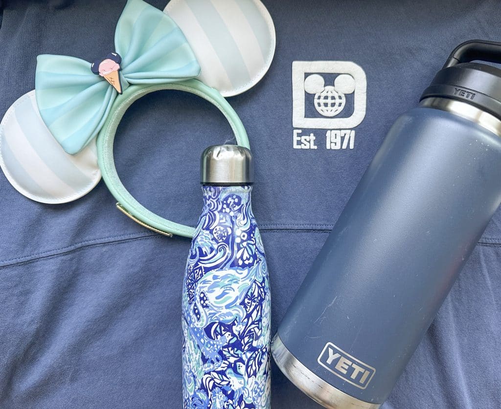 water bottles on Disney shirt