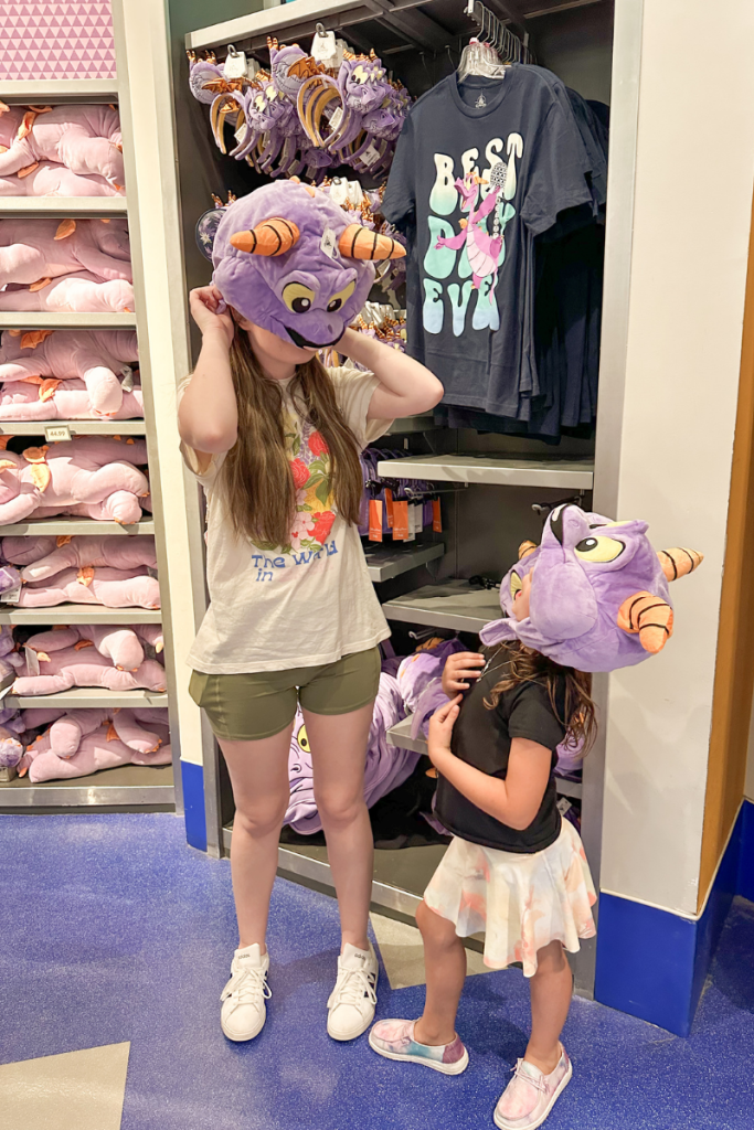 Trying on Figment Merch in Epcot Disney World